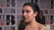 Charli XCX on the Brits 2016 red carpet with James Barr