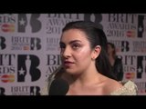 Charli XCX on the Brits 2016 red carpet with James Barr