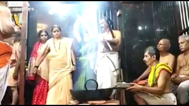 Hindu devotees engage in fiery rite by dipping hands in boiling oil to fulfil vow