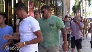Cristiano Ronaldo Pushes A Young Fan While Shopping On Rodeo Drive In Beverly Hills