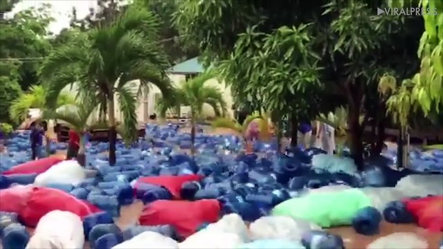 Water Barrels Float Down Flooded Street