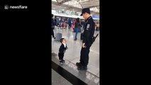 Cute boy just wants a hug from airport security guard
