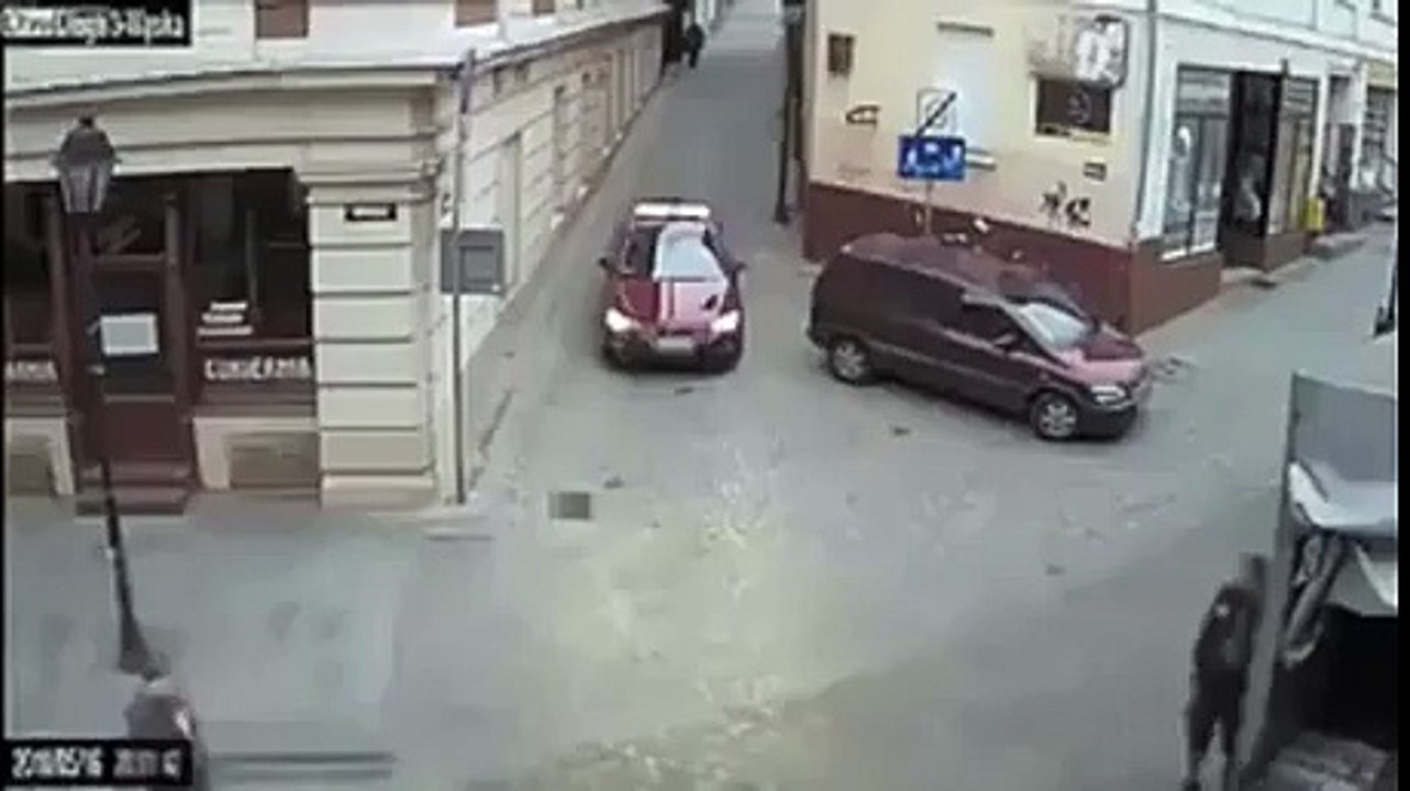 Biker narrowly misses car