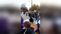 Protestors take a knee as national anthem plays outside Chattanooga Republican rally