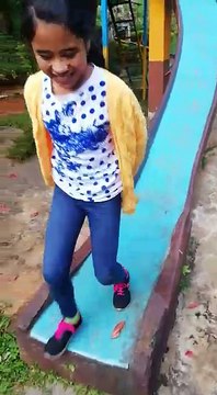 kids playing playing in the park....a slide and trampeline is fun anywhere and at any age!