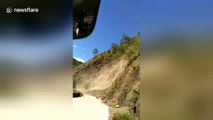Terrifying moment bus passengers scream after getting stuck yards from landslide