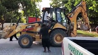 DRUNK TRACTOR DRIVER JUST MISSES CRASHING INTO POLICE VEHICLE - A drunk driver in a massive backhoe put the lives of many in danger on the southern road as he m