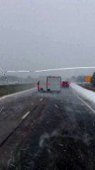 Driver Fishtails on I-80 in Snowy Conditions