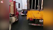 2 người đàn ông đi ô tô chặn đầu xe tải giữa đường để giái quyết mâu thuẫn gây bức xúc