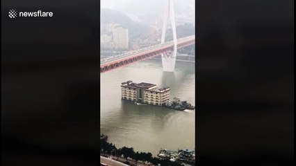 'Floating apartment building' boat moved downriver in China