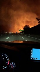 Helicopter Drops Water on Intense Fire