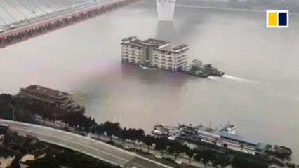 ‘Five-storey building’ floats downriver