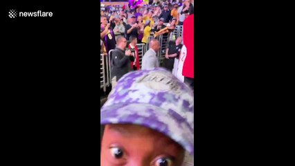 Young fan freaks out when LeBron hands his arm sleeve to him