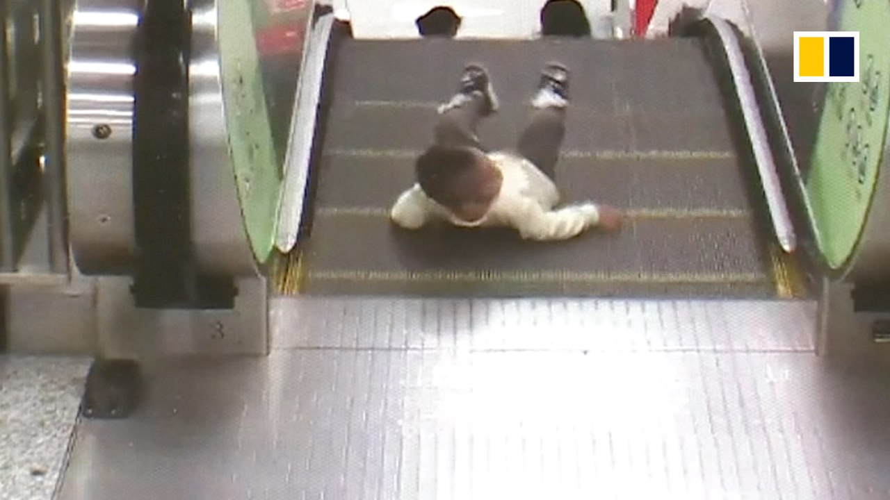 Toddler rescued from escalator one second before disaster