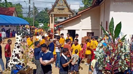 Children Hand Out Food During Buddhist Festival