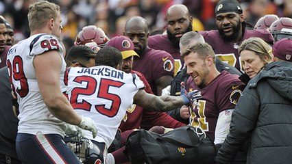 Alex Smith waves to crowd as he's carted off the field