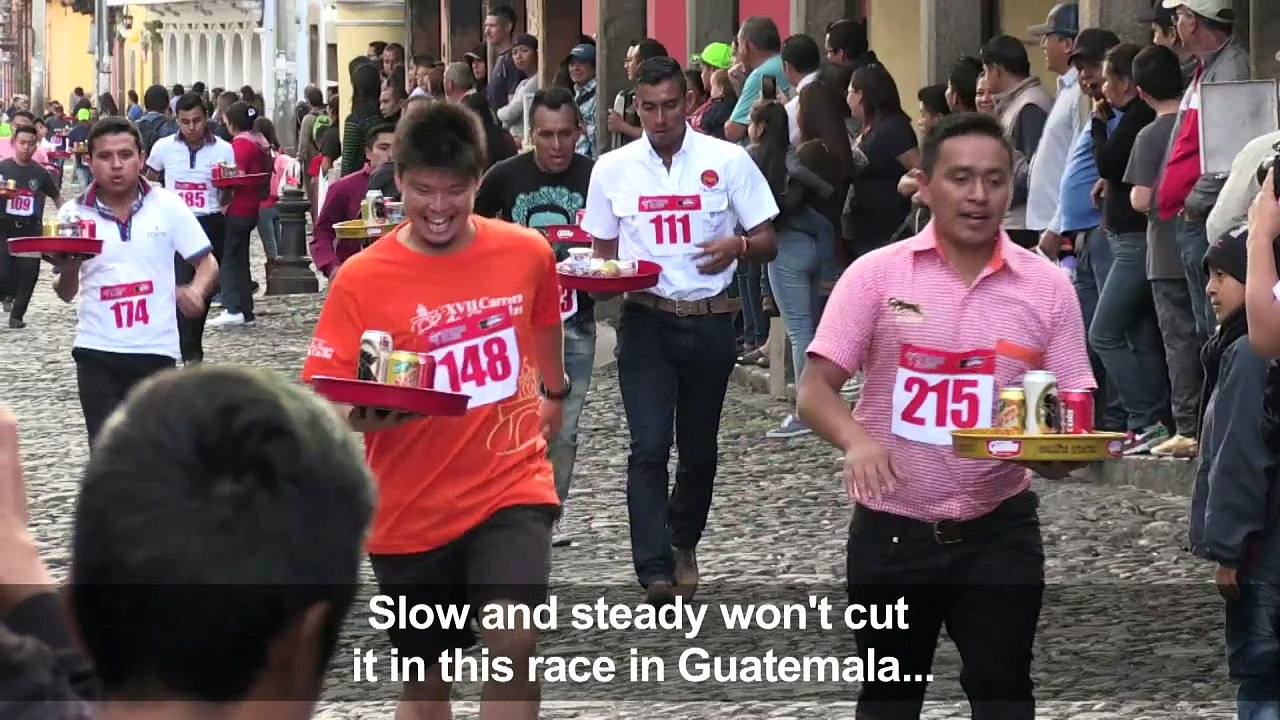Waiters race down cobbled streets in Guatemala's Antigua