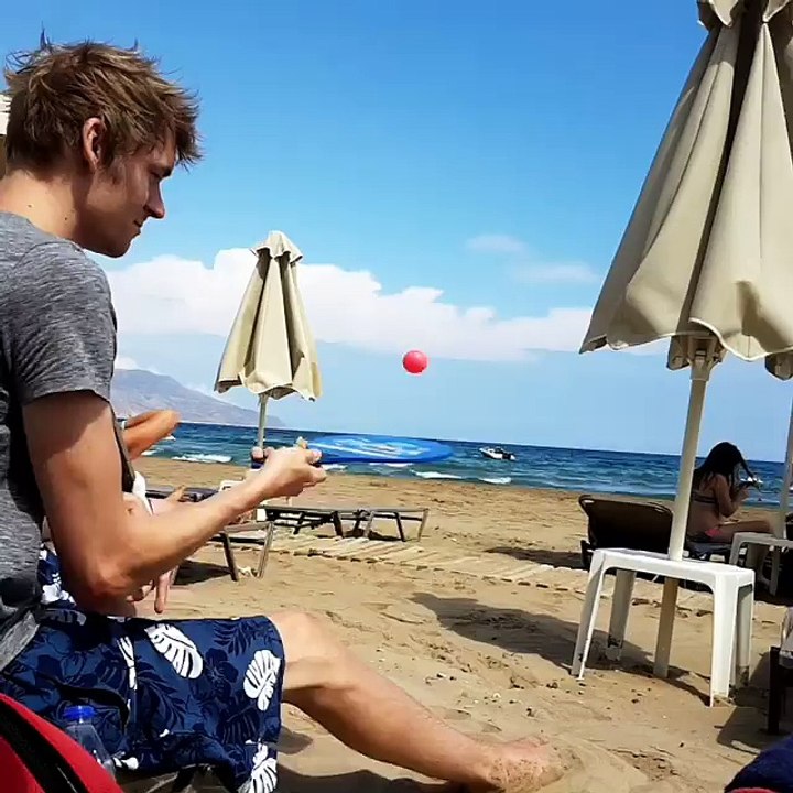 Plaing bing ball on the beach with fast talented way