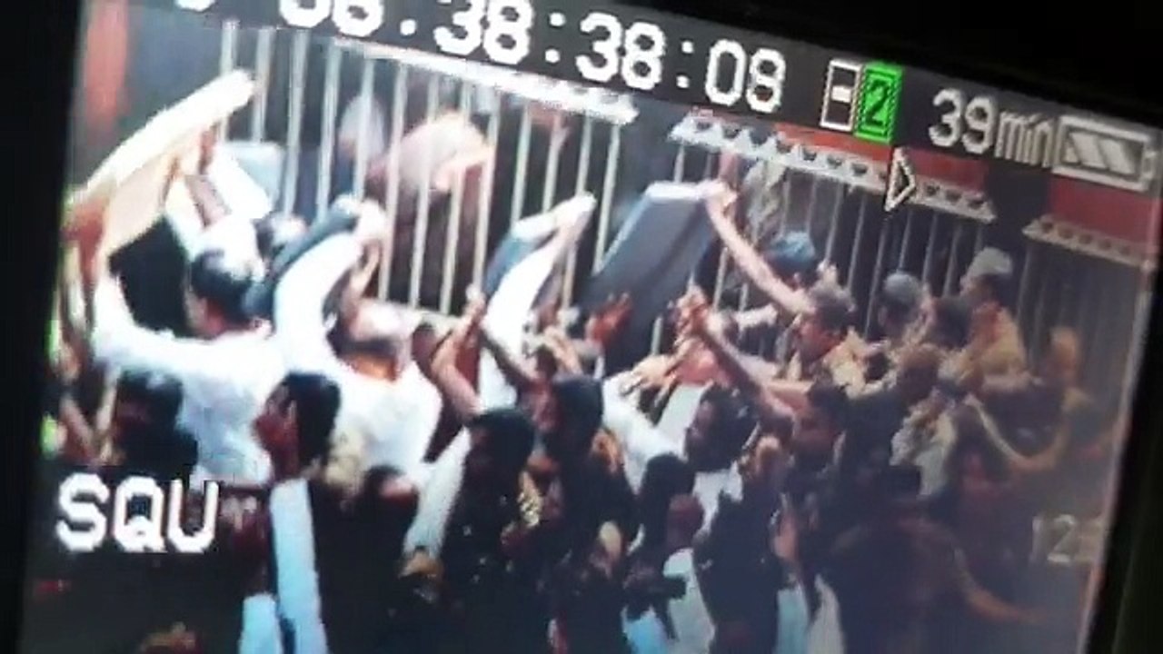 Johnston Fernando throwing a chair towards Police officers