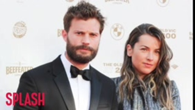 Jamie Dornan watches wife work