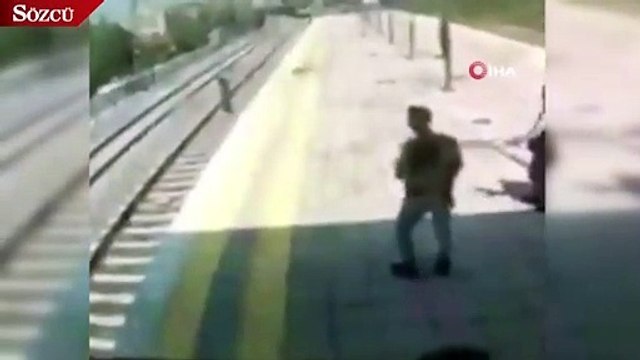 Trenin önüne atlayıp intihara kalkışan kadını böyle kurtardı