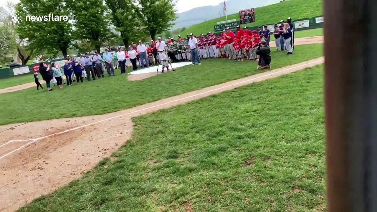 Touching moment boy with rare condition throws opening pitch of Little League season
