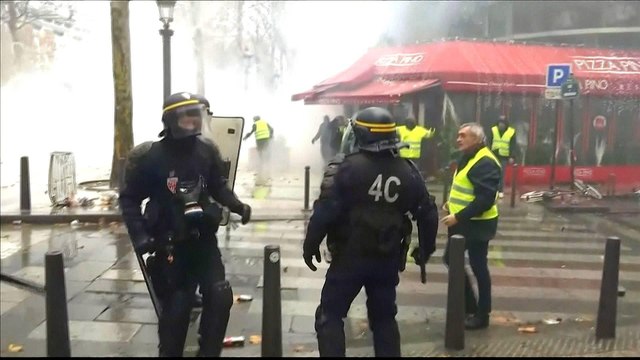 French police fire tear gas, water cannon at protesters in Paris