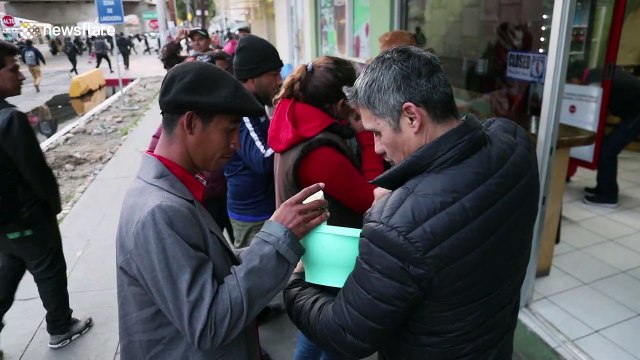 Footage shows local Tijuana shop owner serving food to Honduran migrants