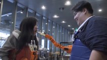 This robotic arm will feed you every time you smile