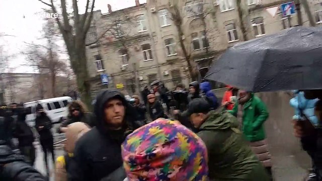Flares and fire as Ukrainians protest outside Russian consulate in Kharkiv