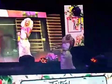 valentina throws a bottle into a crowd