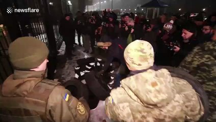 Protestors hurl flares, set tires on fire outside Russia embassy in Kiev