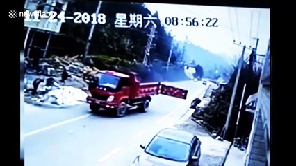 Family on scooter taken out by back door on lorry trailer