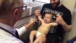 a  doctor to inject injection to baby great