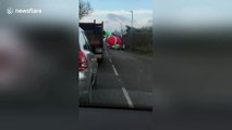 Giant inflatable Santa drifts onto road causing traffic chaos