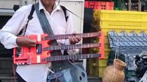 Thai Man With Triple Neck Guitar