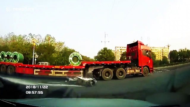 Scooter driver narrowly escapes being run over by lorry