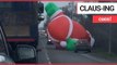 Bizarre footage shows a giant inflatable Santa Claus blocking traffic | SWNS TV