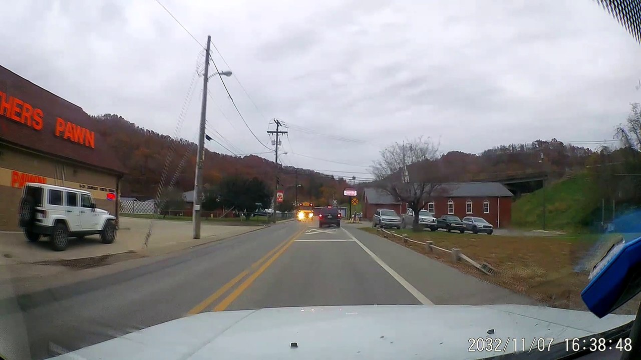 School Bus Honks Horn at Car to Protect Children