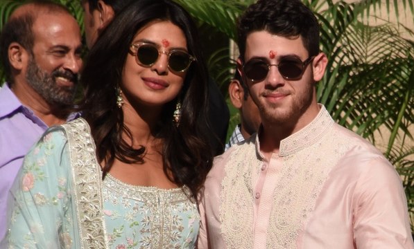 Priyanka Chopra and Nick Jonas as they step out of their family puja