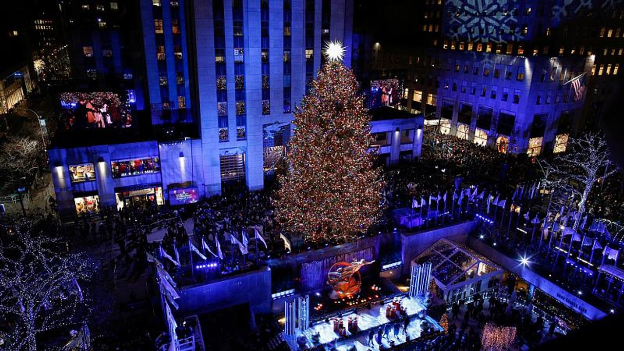 Sprucing up NYC: Rockefeller Center lights Christmas tree