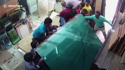 Workers trapped under glass sheets, rescued in nick of time