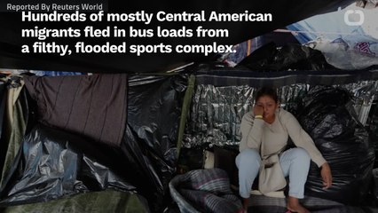 Migrants Move Shelters After Torrential Rains