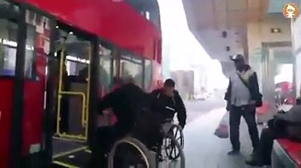 Two men in wheelchair fight over bus