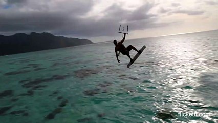 Parasail surfer jumps in front of overwater bungalow