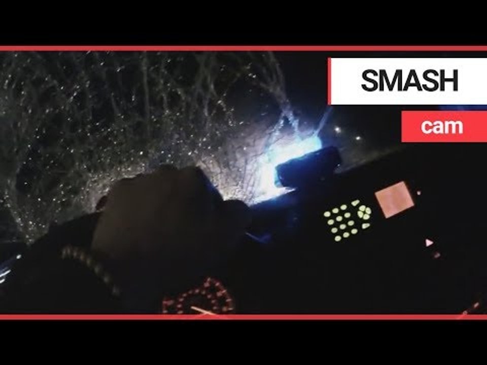 Shocking dashcam captures moment thugs smash police car with sledgehammers | SWNS TV
