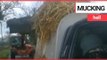 Tractor driver chases hunt saboteurs and tips manure over their van | SWNS TV