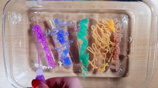 Mixing Glitter Glue into Clear Slime