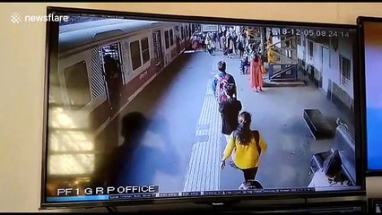 Two women saved by Indian railway police after being thrown from moving train