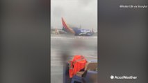 Plane slides off runway during heavy rain